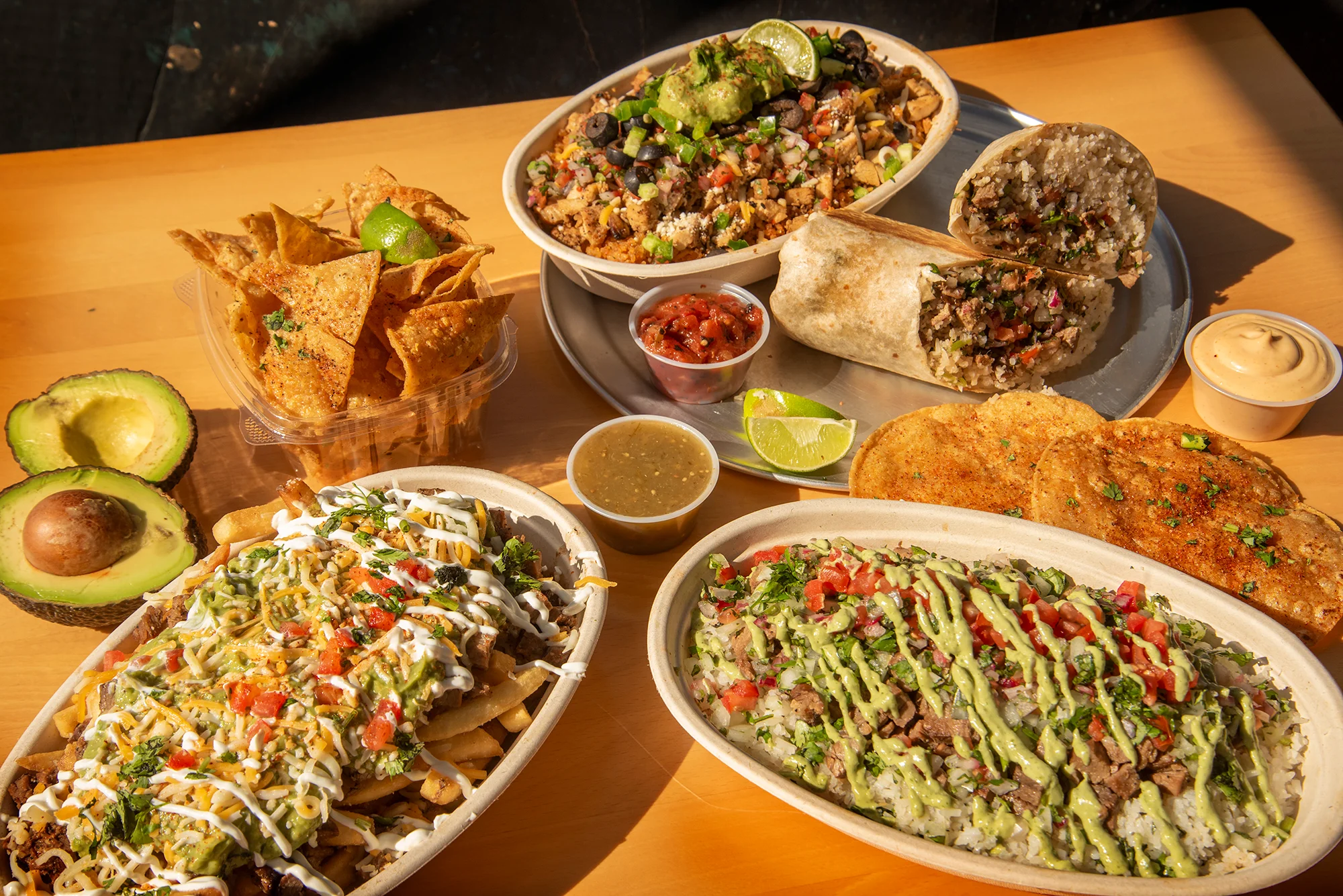 Mexican burrito and loaded nachos with guacamole