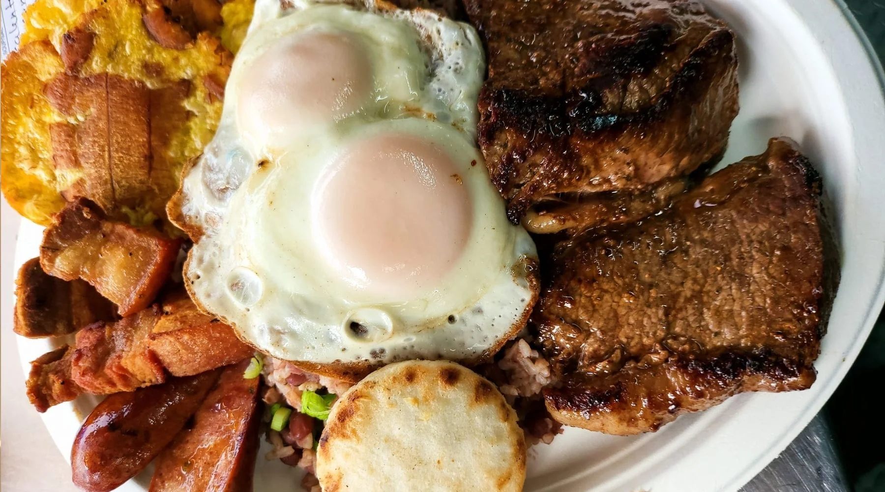 Traditional Costa Rican casado with eggs and steak
