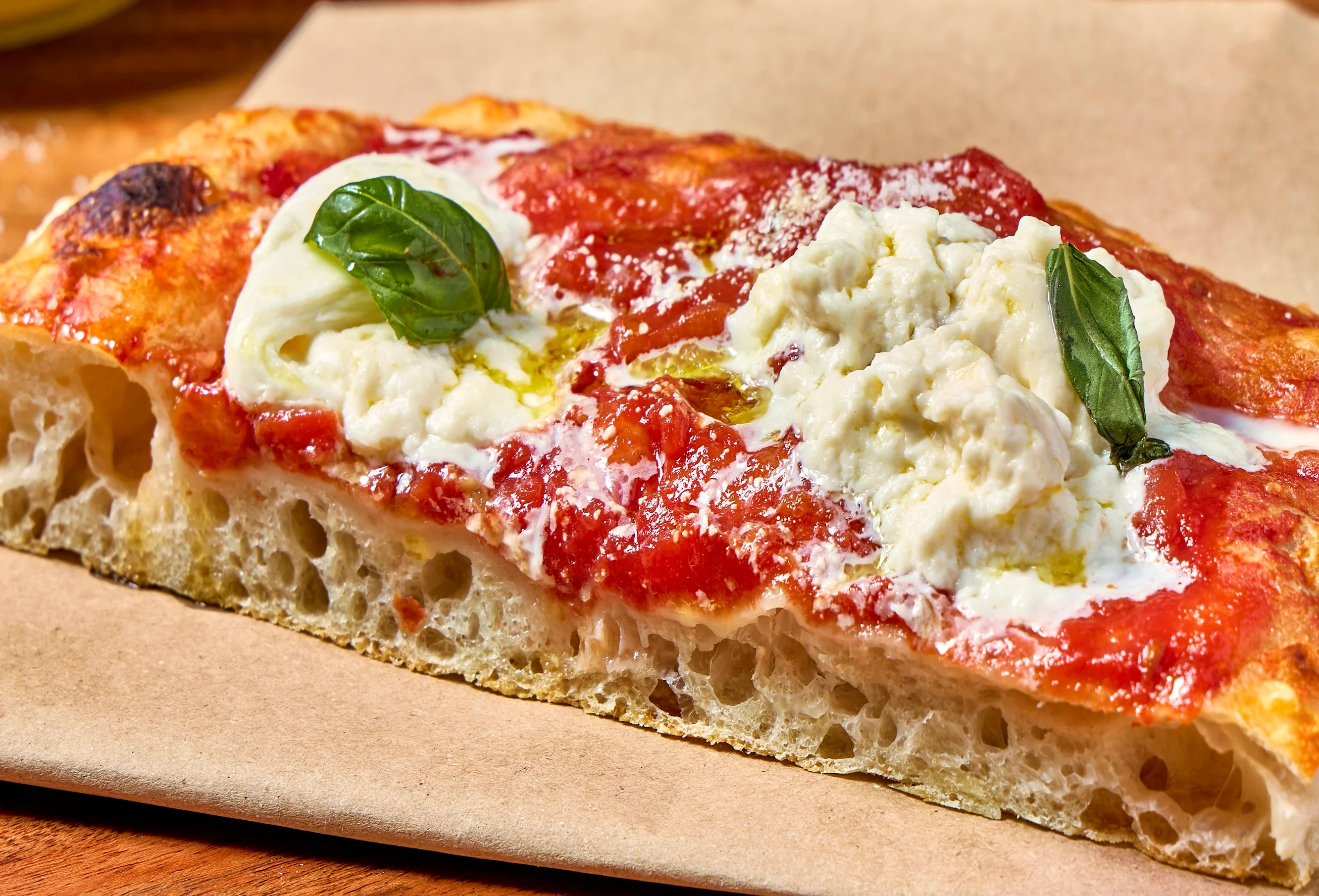 Roman-style pizza with tomato sauce and fresh basil