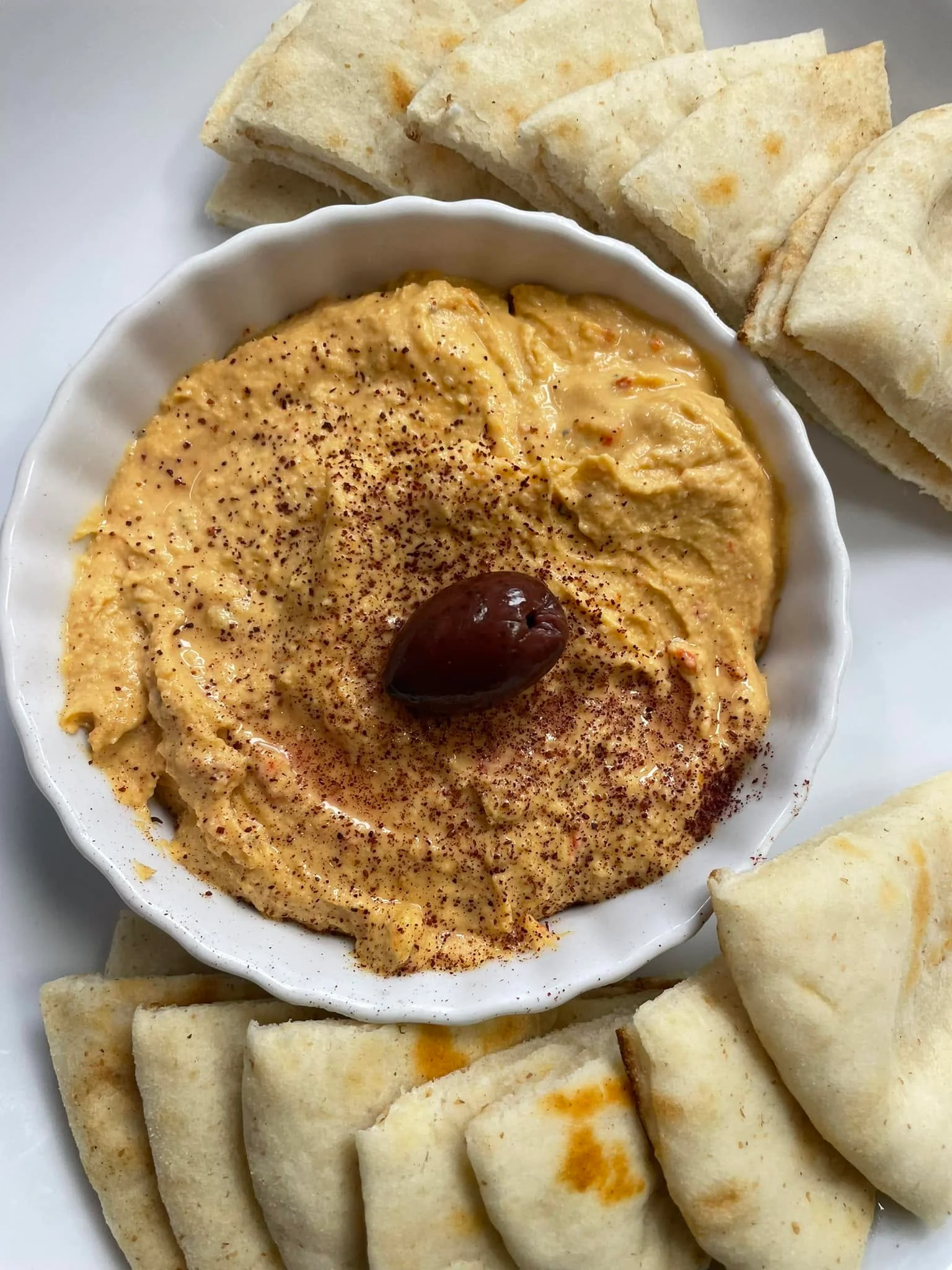 Creamy hummus served with pita bread