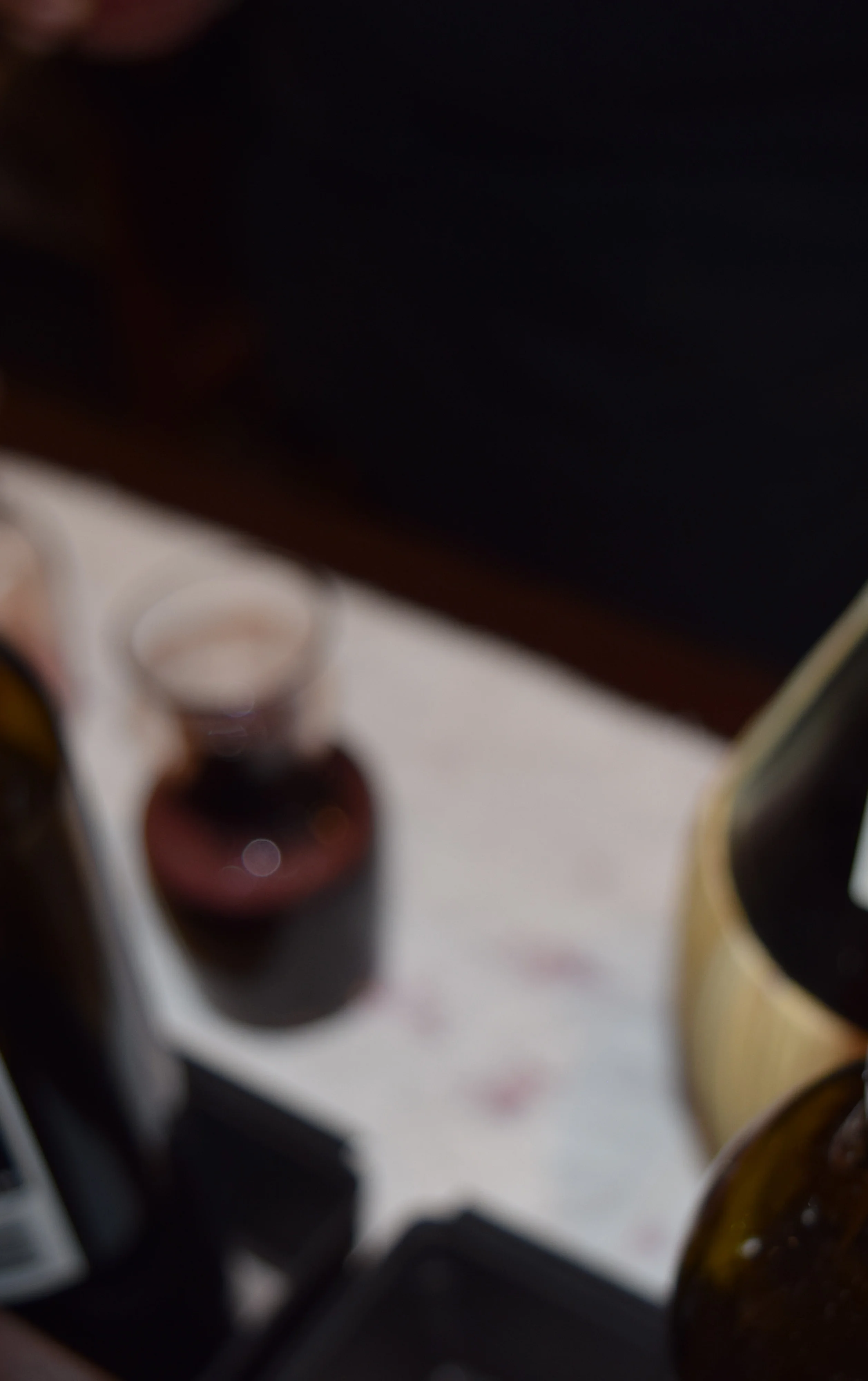 Bartender pouring wine at a stylish bar