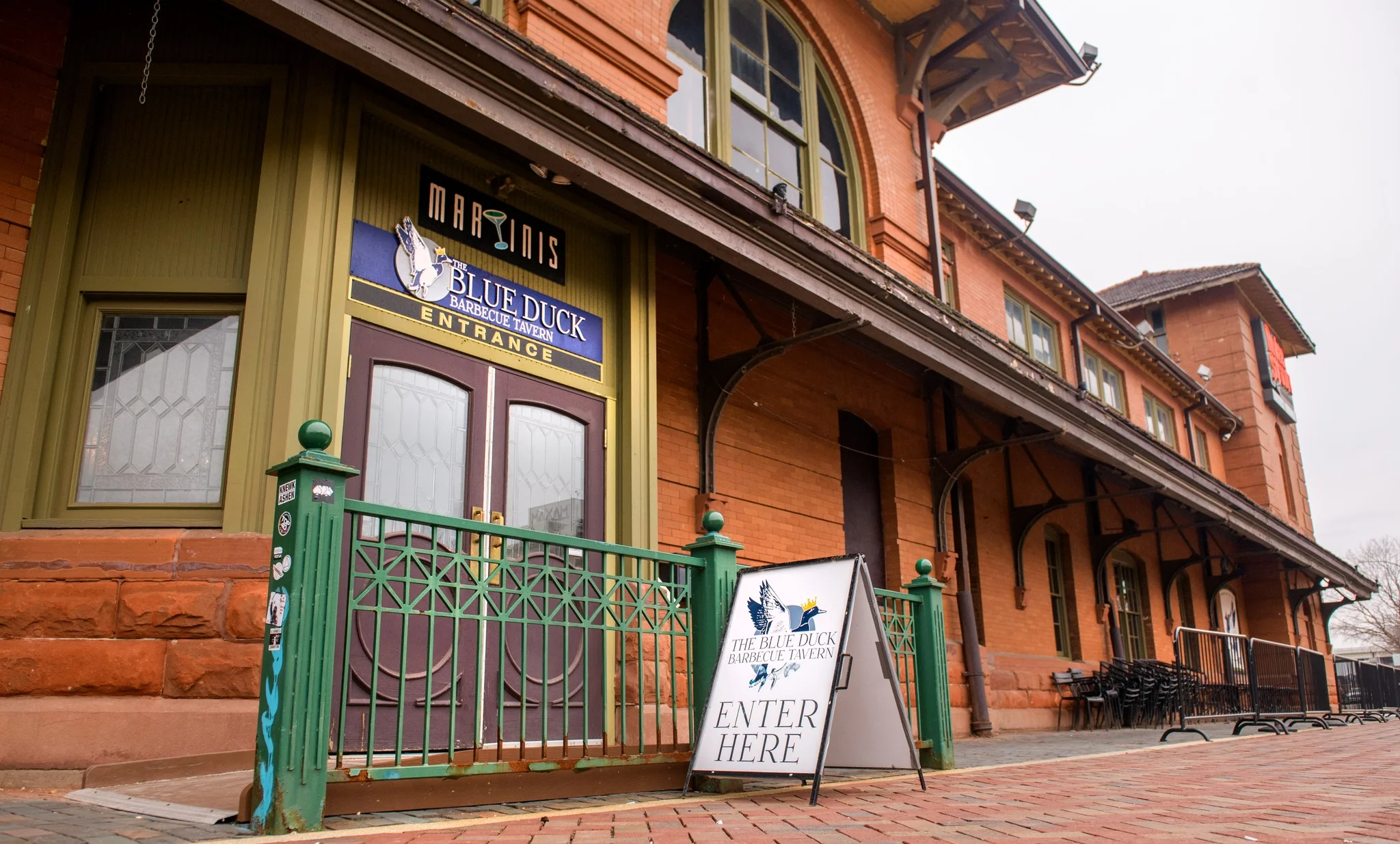 Entrance of The Blue Duck Barbecue Tavern with inviting signage