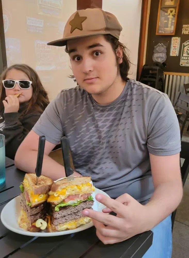 Giant American cheeseburger stack with fries