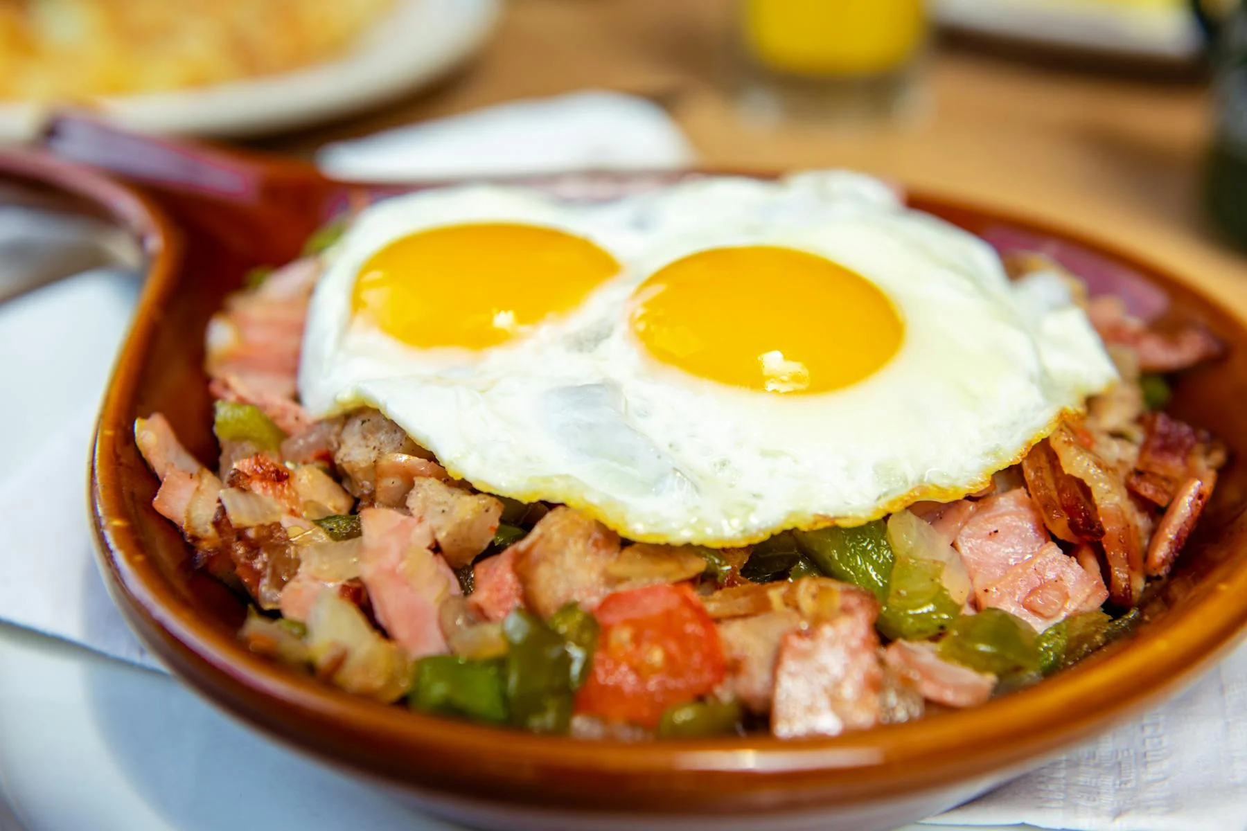 Hearty breakfast hash with eggs on top