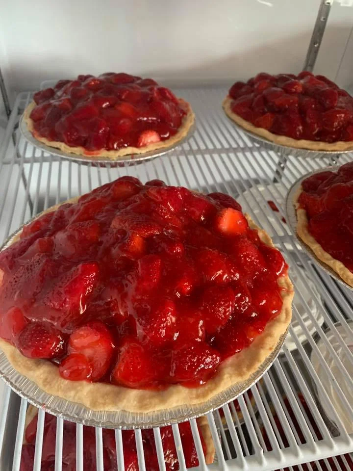 Fresh strawberry pie in a bakery display