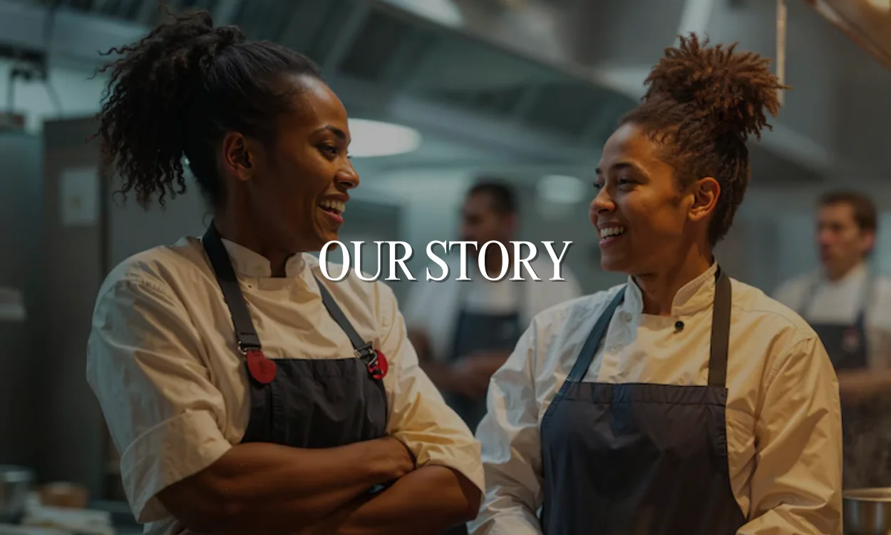 Chefs smiling in a modern kitchen during a culinary collaboration