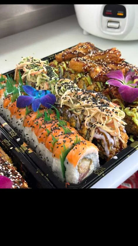 Artfully arranged sushi platter with various rolls