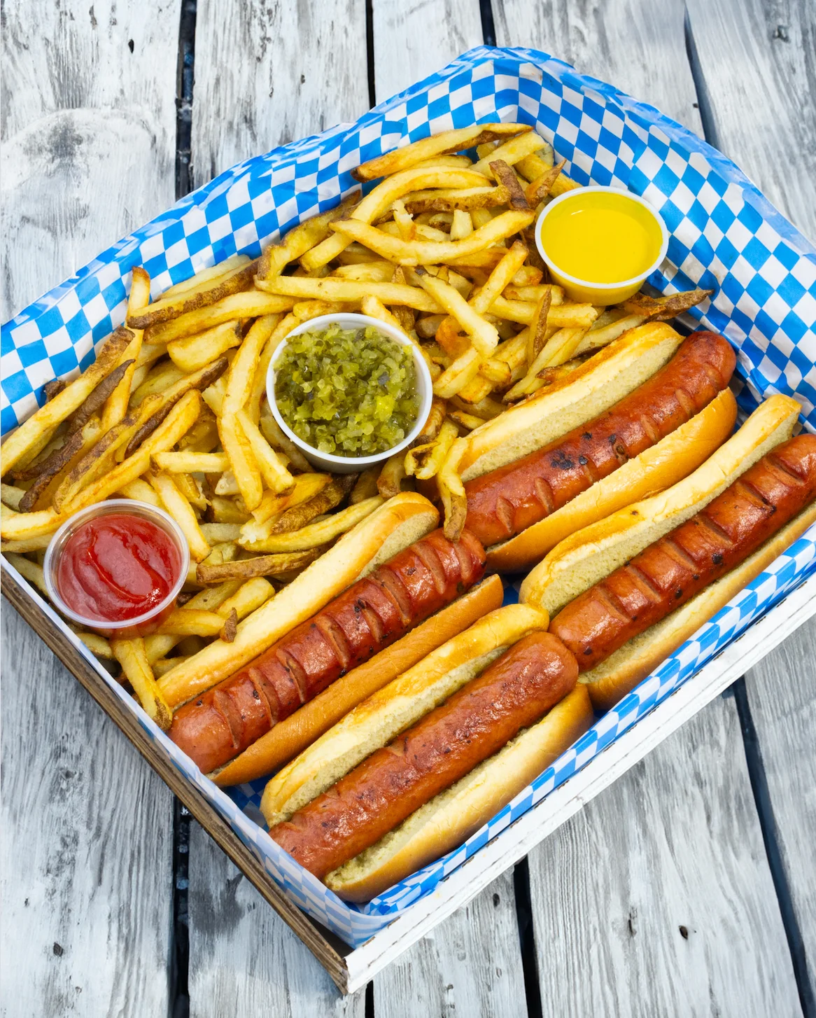 Classic American hot dogs with fries and condiments