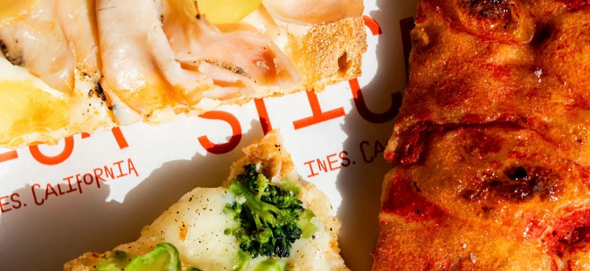 Assorted slices of gourmet pizza on a restaurant plate