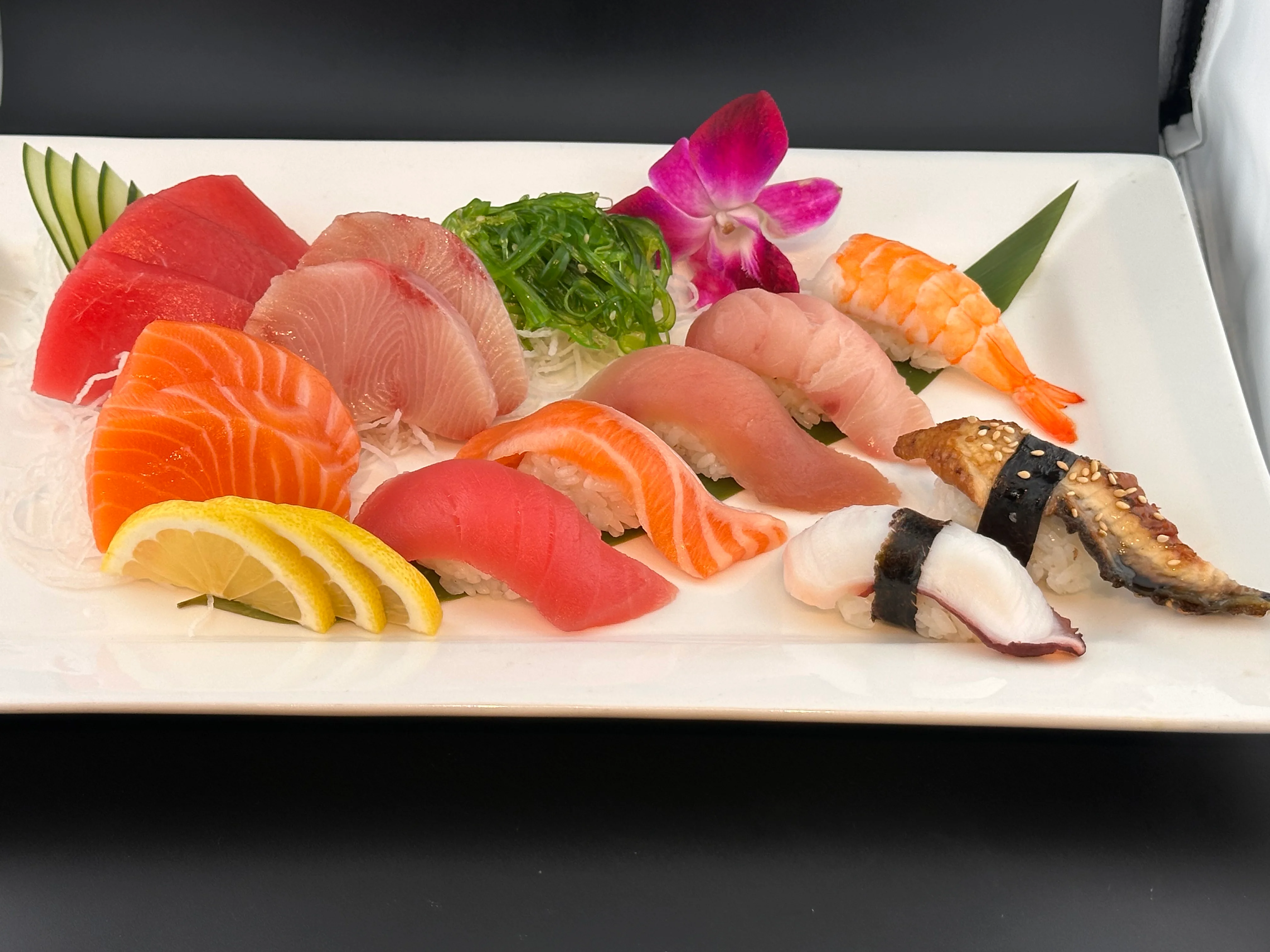 Assorted Japanese sushi platter with fresh fish and garnishes