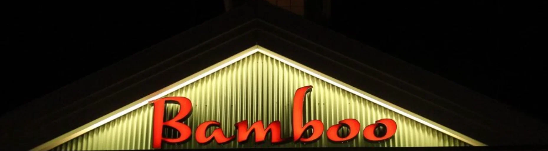 Bamboo restaurant sign illuminated at night