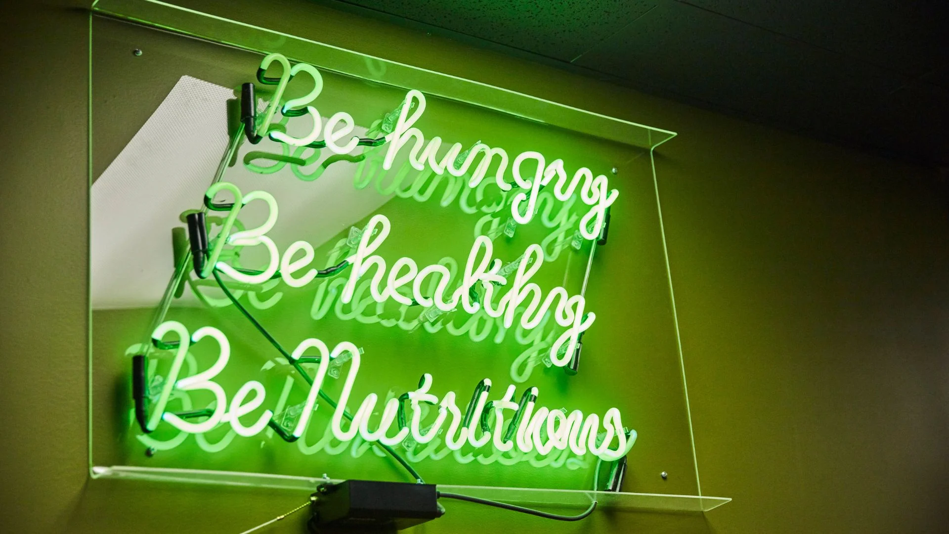 Inspirational neon sign promoting healthy eating