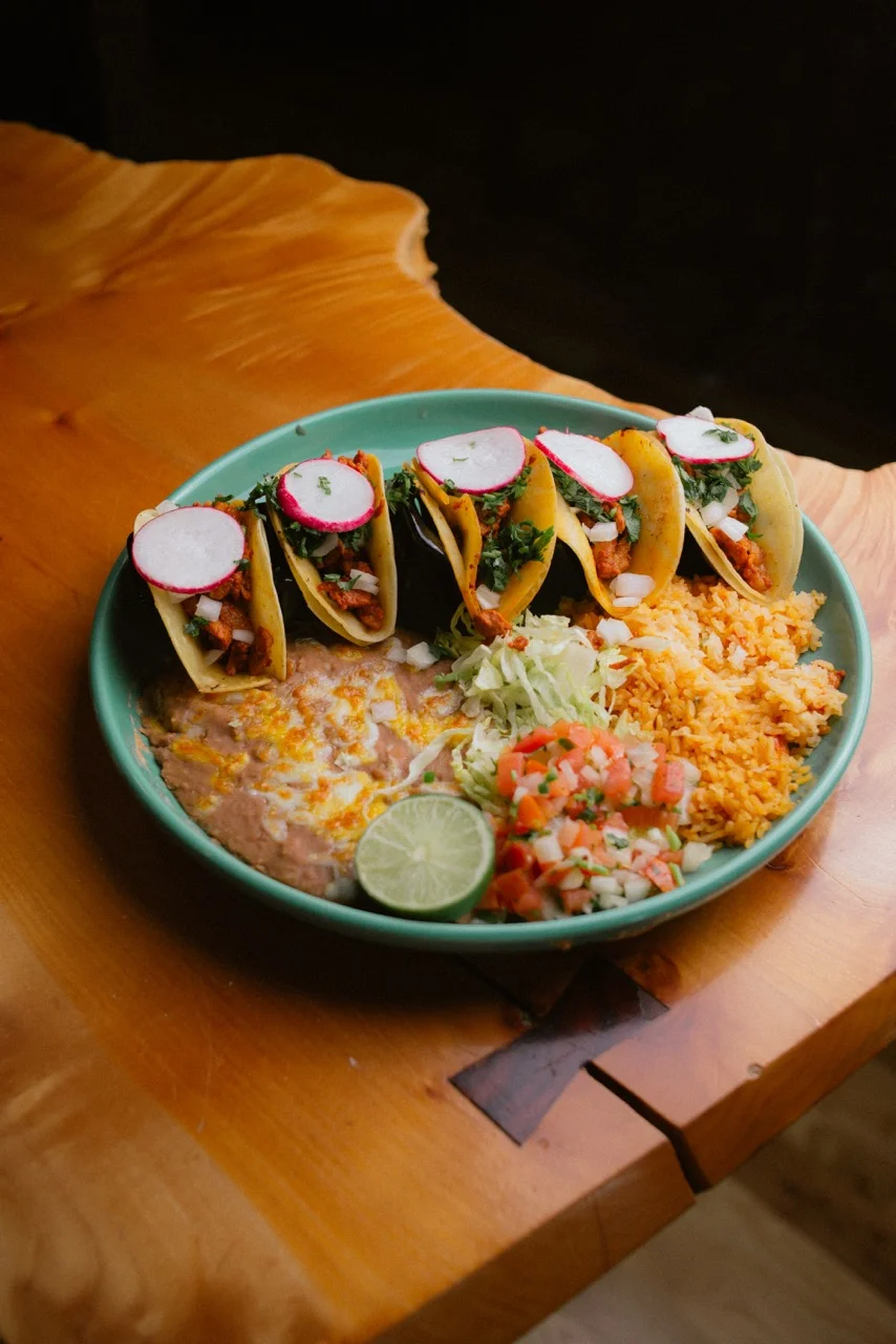 A beautifully plated dish with vibrant colors and garnishes.