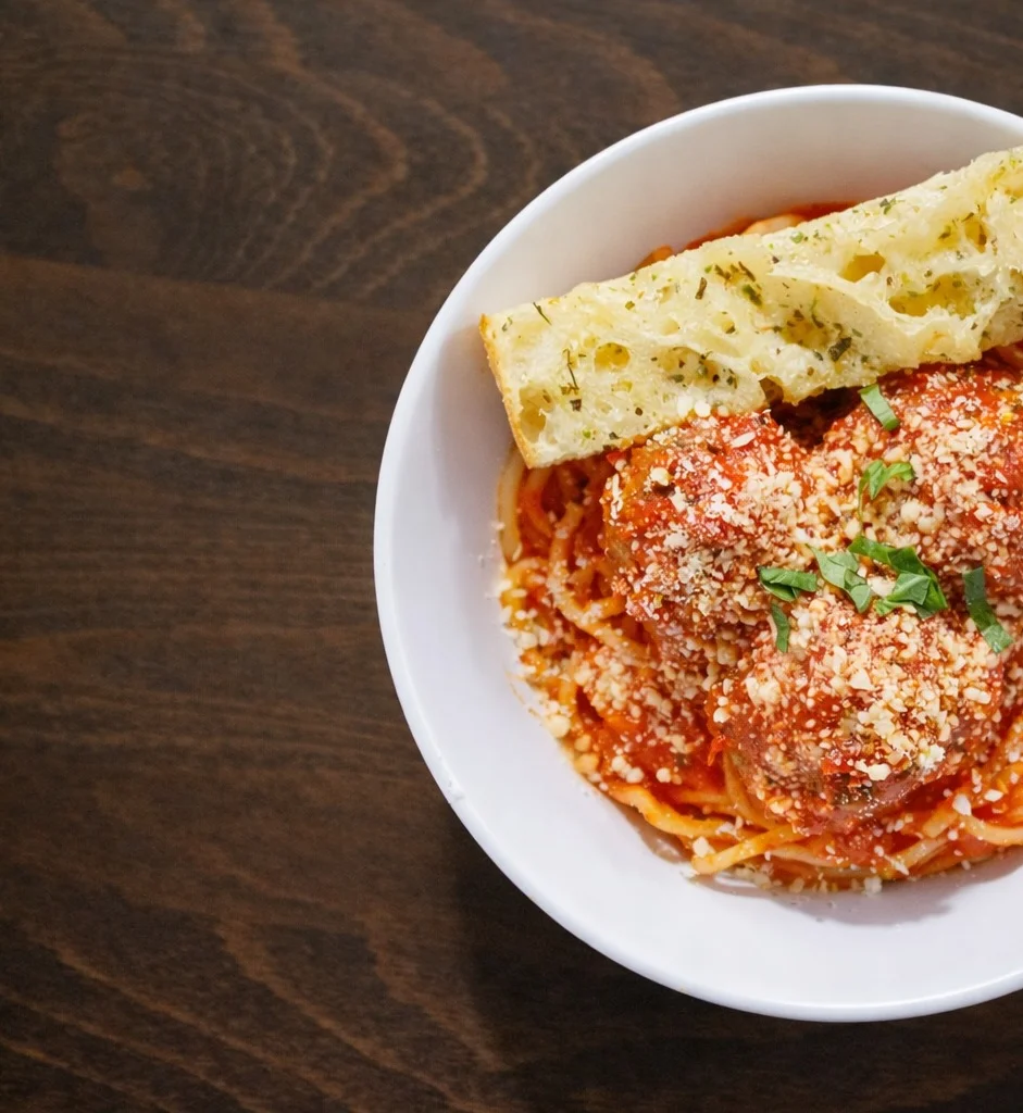 Spaghetti and house meatballs with garlic-buttered focaccia