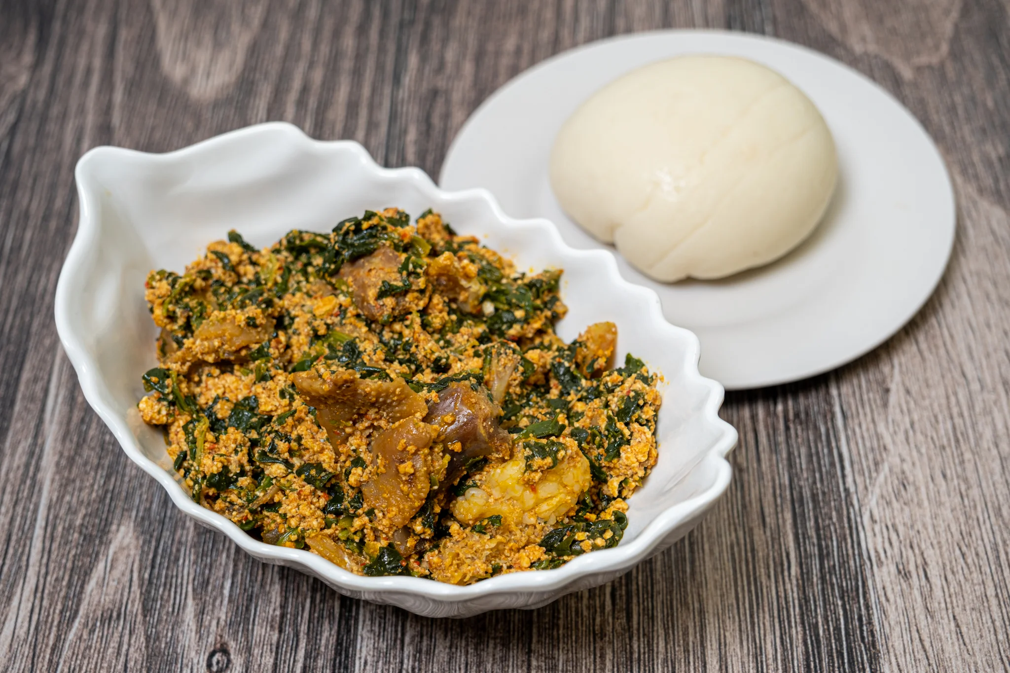 Nigerian egusi soup served with fufu