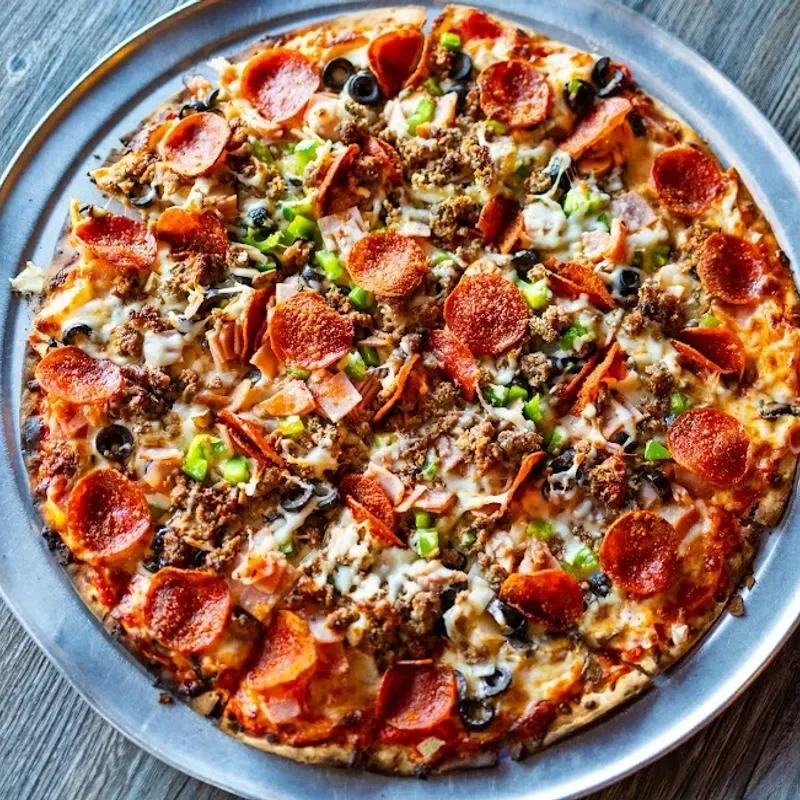 Loaded meat lover's pizza with pepperoni and olives