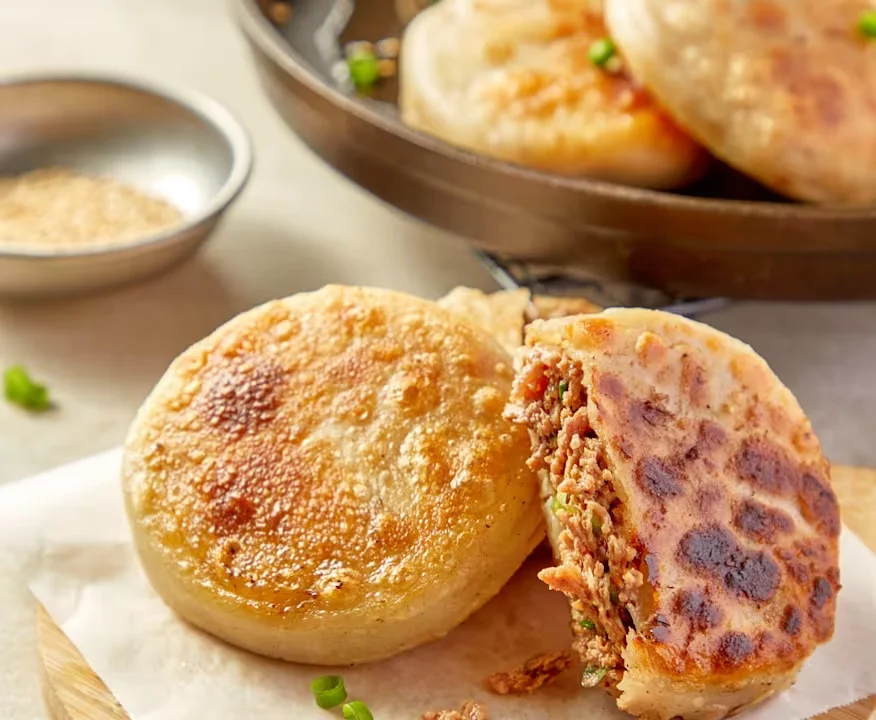 Juicy Wagyu beef and onion pie served on a plate.