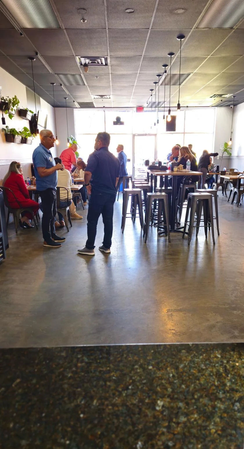 Modern restaurant interior with lively atmosphere and seating