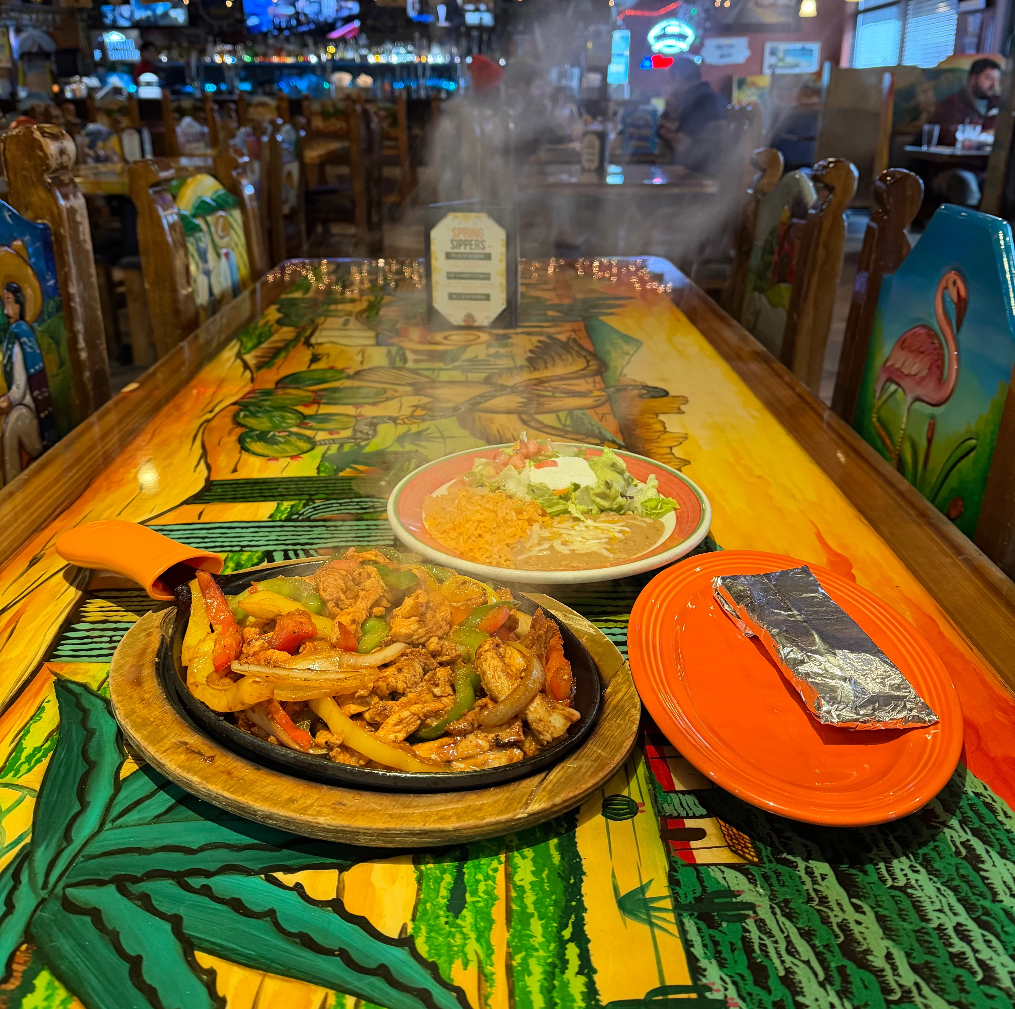 Delicious gourmet burger with fresh toppings on a wooden table