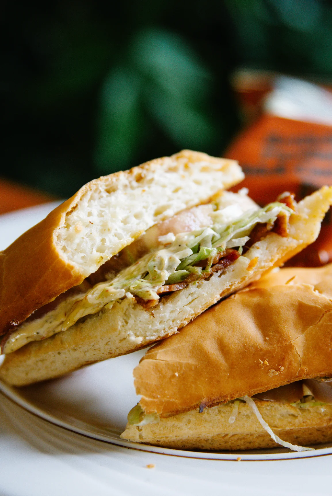 Cuban sandwich with layers of meat and pickles