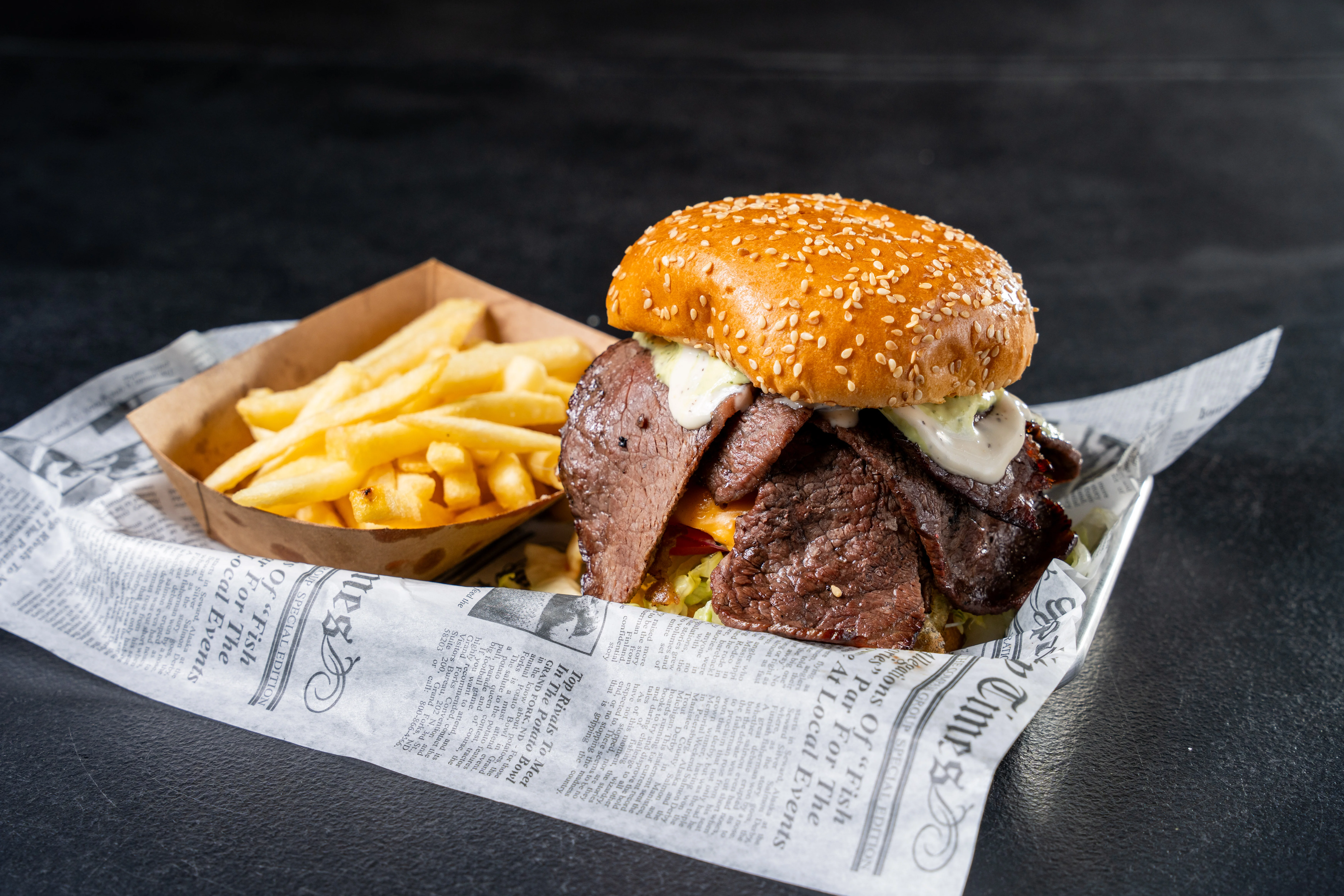 Hearty American brisket burger with fries