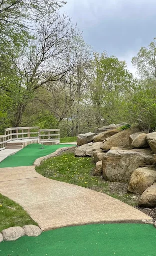 Scenic pathway with rocks and greenery in a park setting