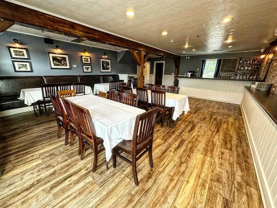 Cozy restaurant interior with wooden tables and warm lighting