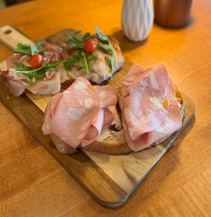 Italian charcuterie board with assorted meats and fresh herbs