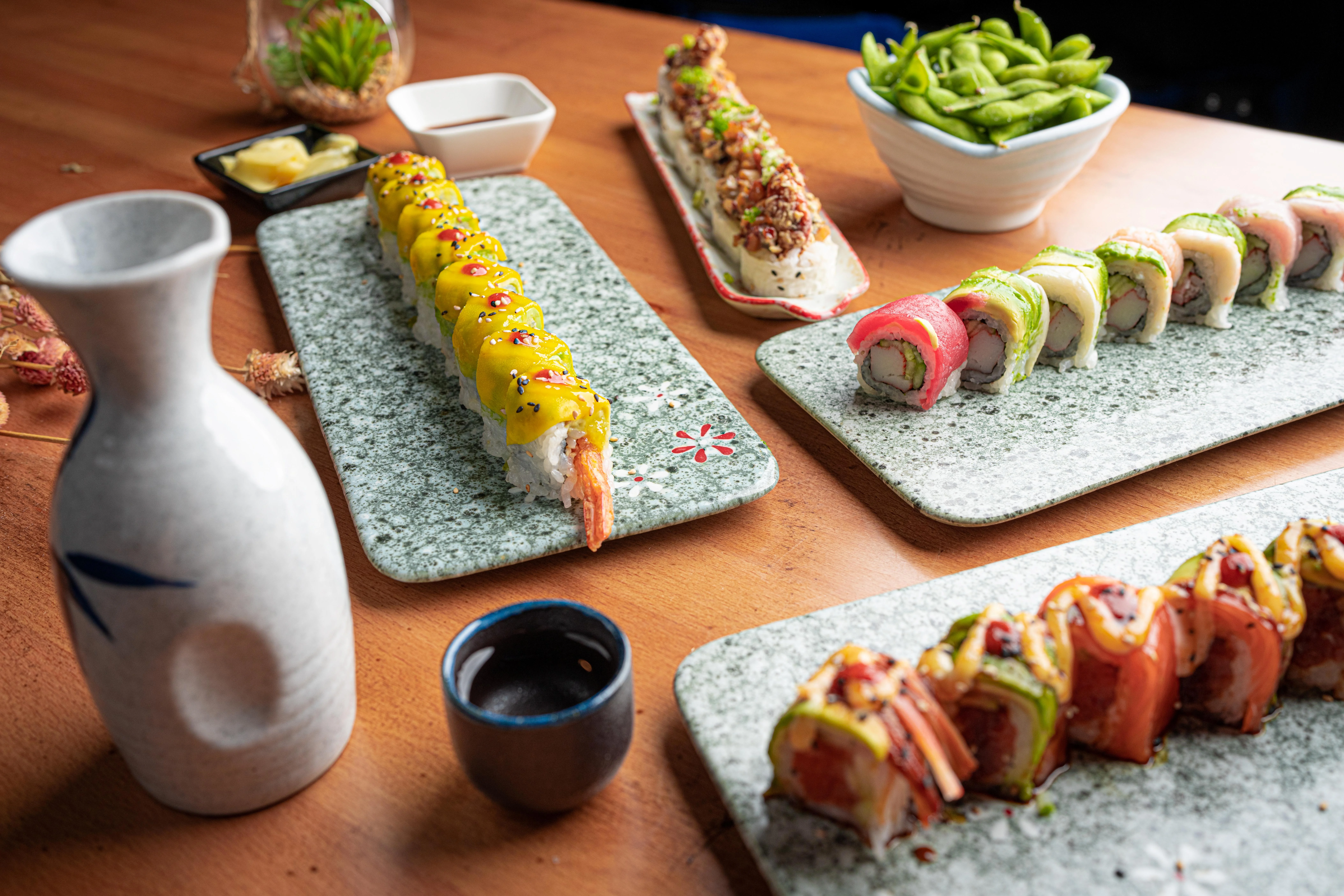 Assorted sushi rolls on decorative plates at Ginza Japanese Restaurant located at 5868 San Felipe Street, Houston, TX 77057