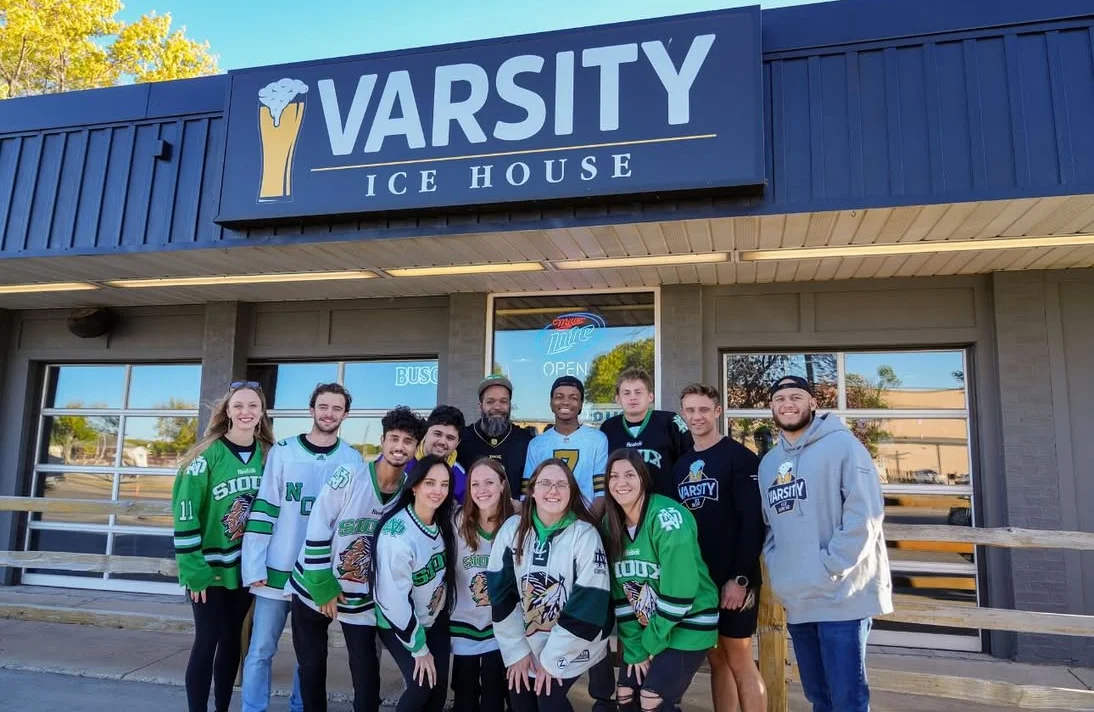 Group of friends at Varsity Ice House in team jerseys