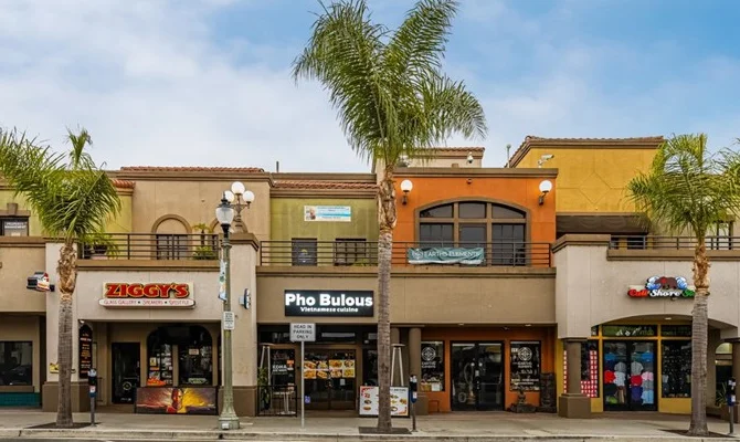 Colorful restaurant row featuring Ziggy's and Pho Bulous