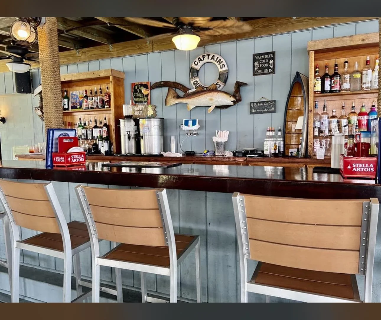 Cozy bar interior with wooden accents and a variety of spirits