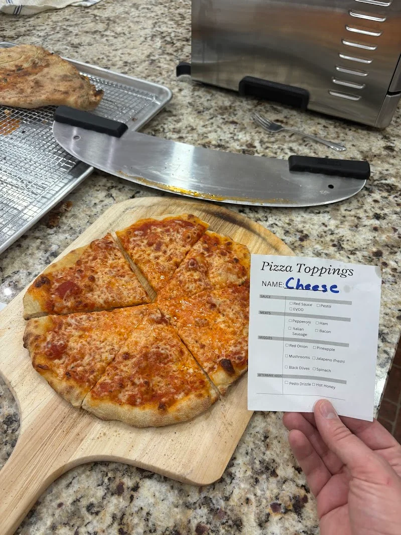 Classic cheese pizza on a wooden board