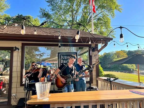 Band playing under the tiki roof at Sunset Grill