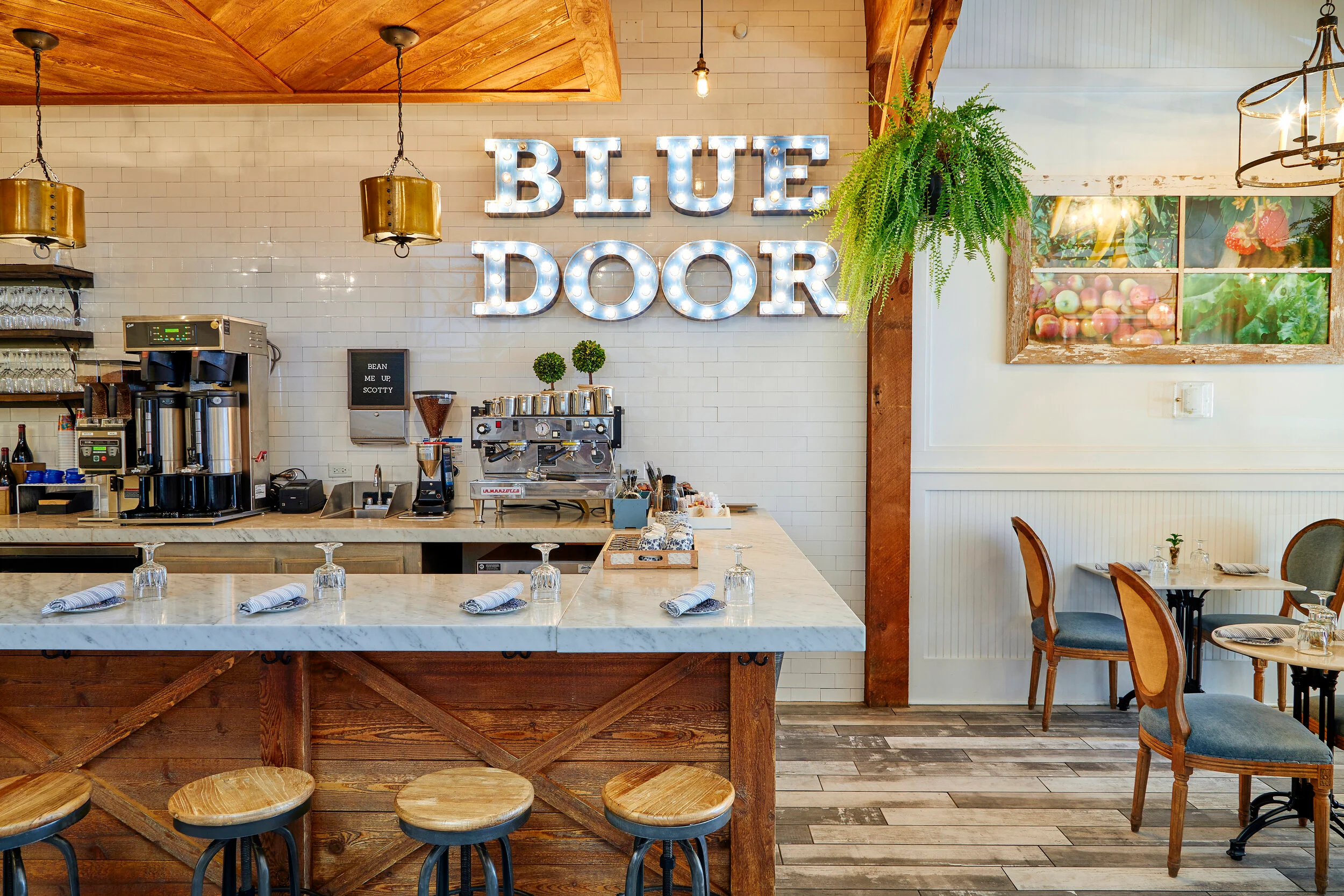 Charming restaurant interior with a bar and decorative plants