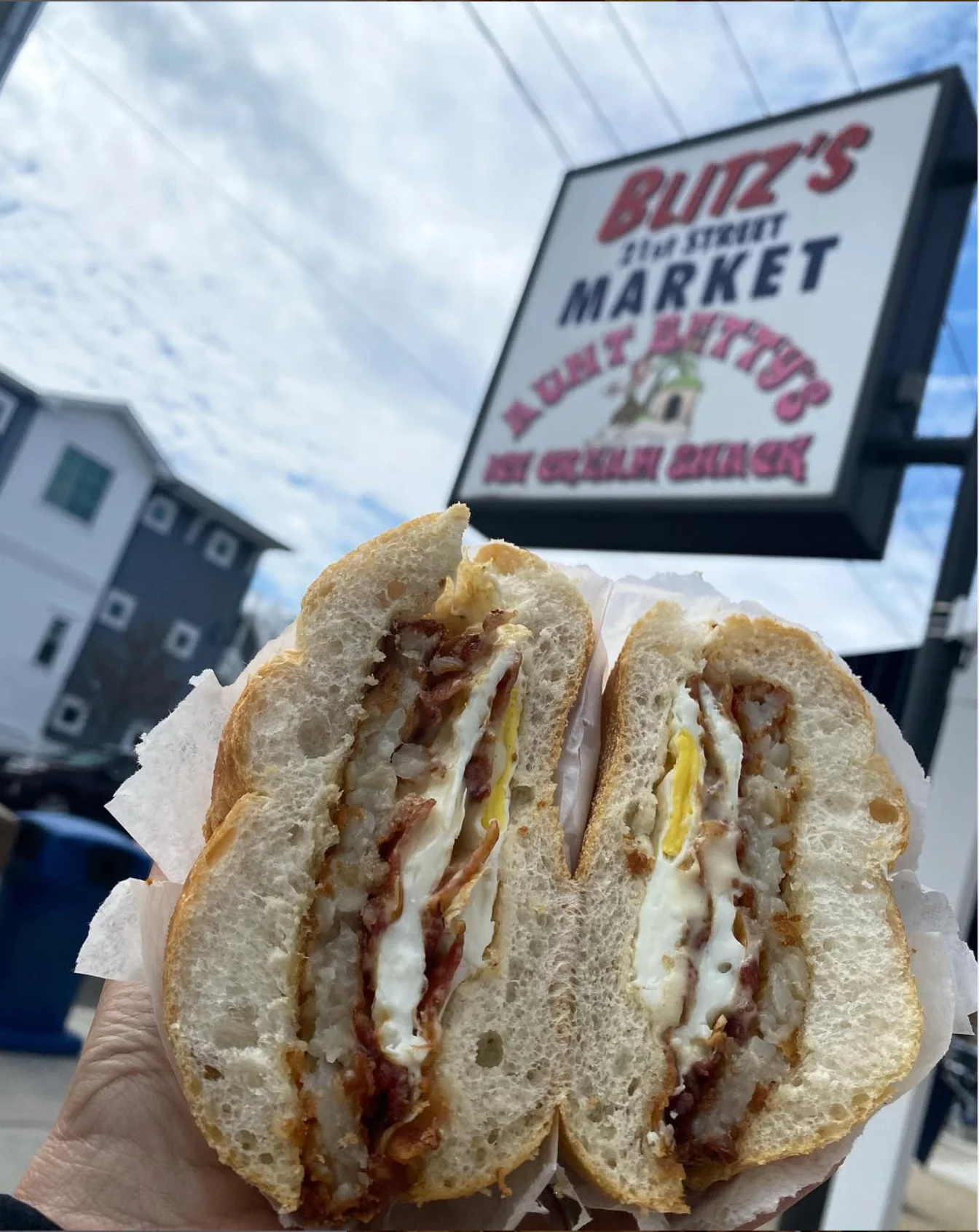 Breakfast sandwich featuring crispy bacon and egg