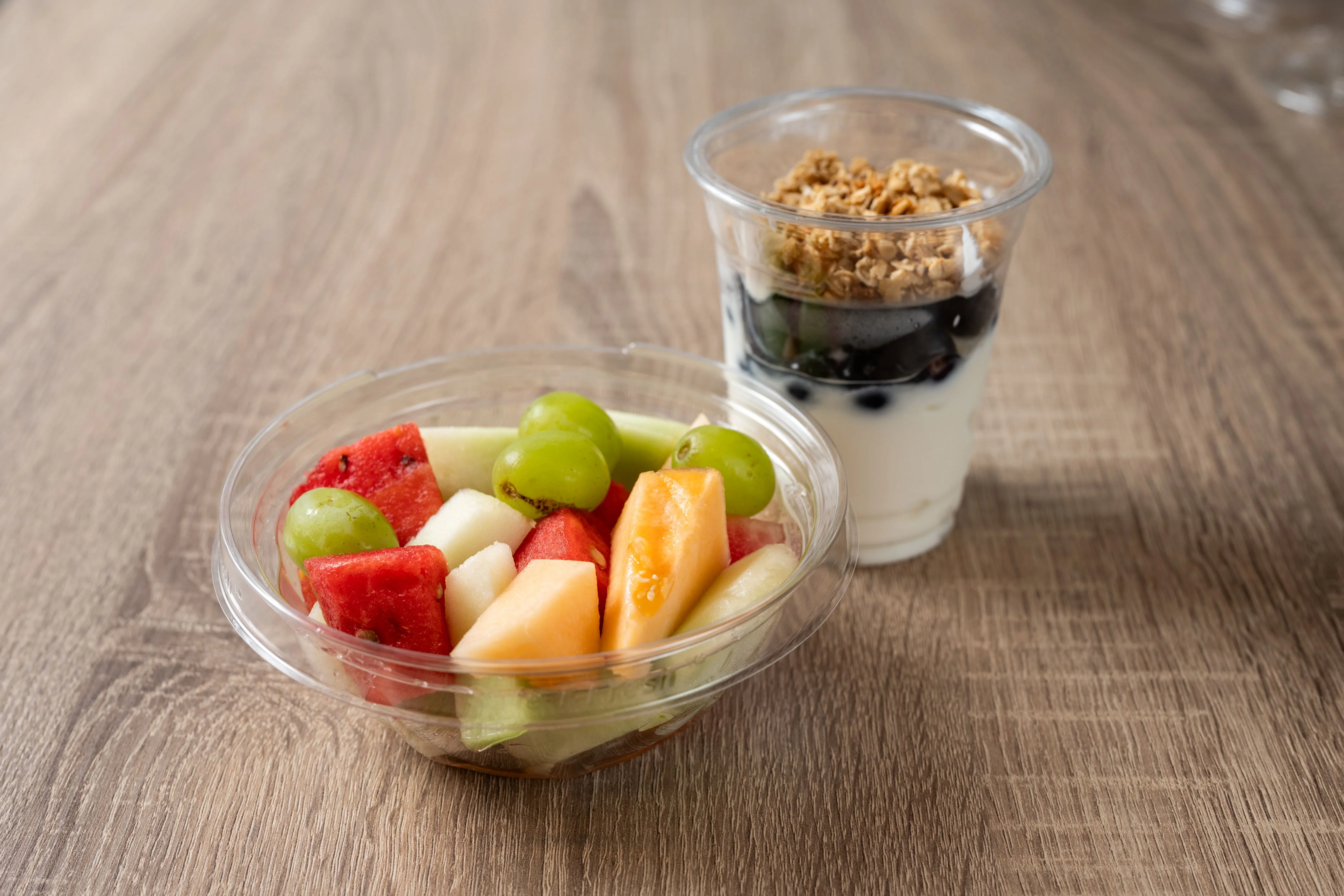 Delicious deli sandwich with fresh ingredients on a wooden table.