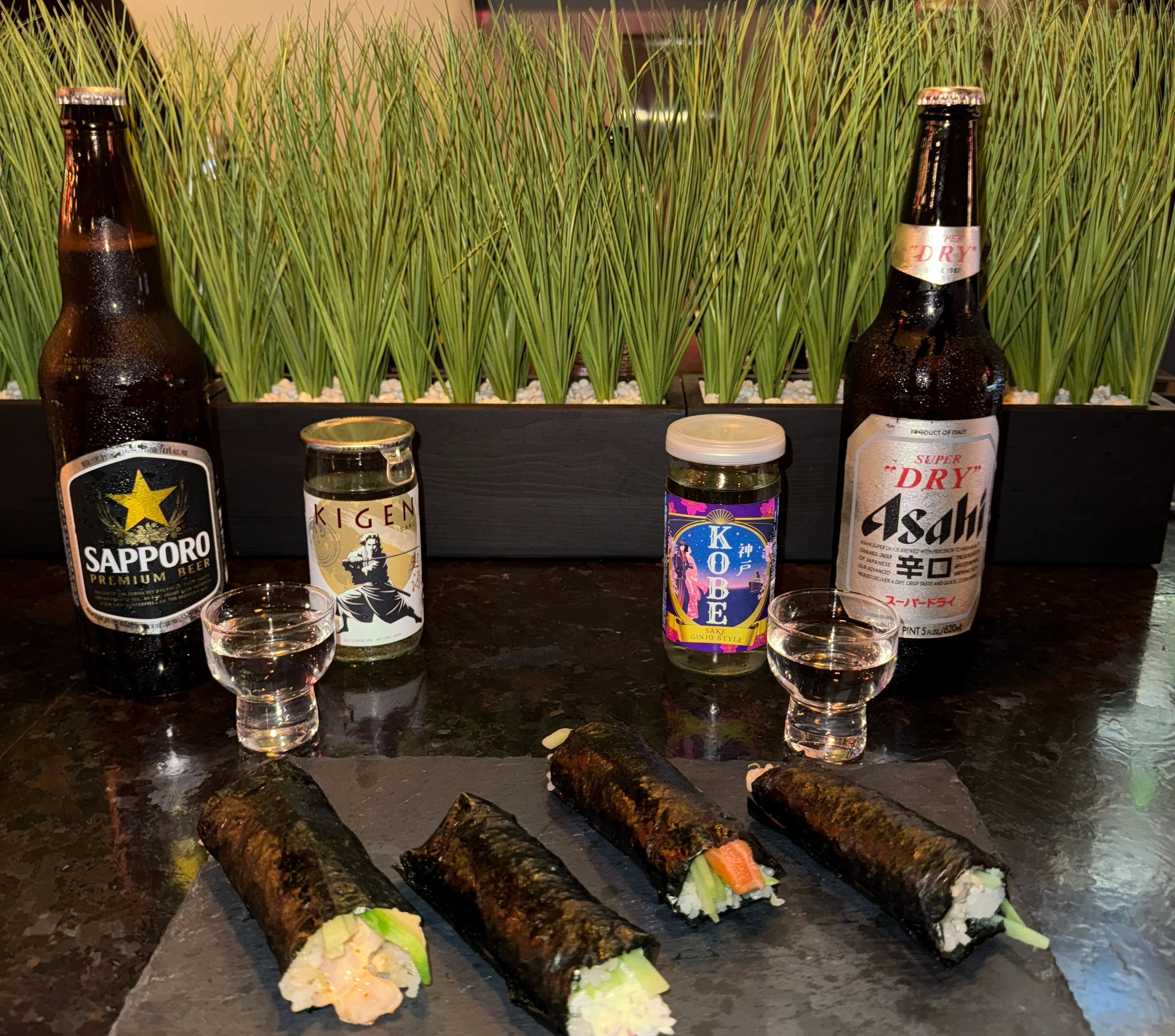 Handroll Bar Experience setup with sushi, beer, and shot glasses in Gaslamp San Diego