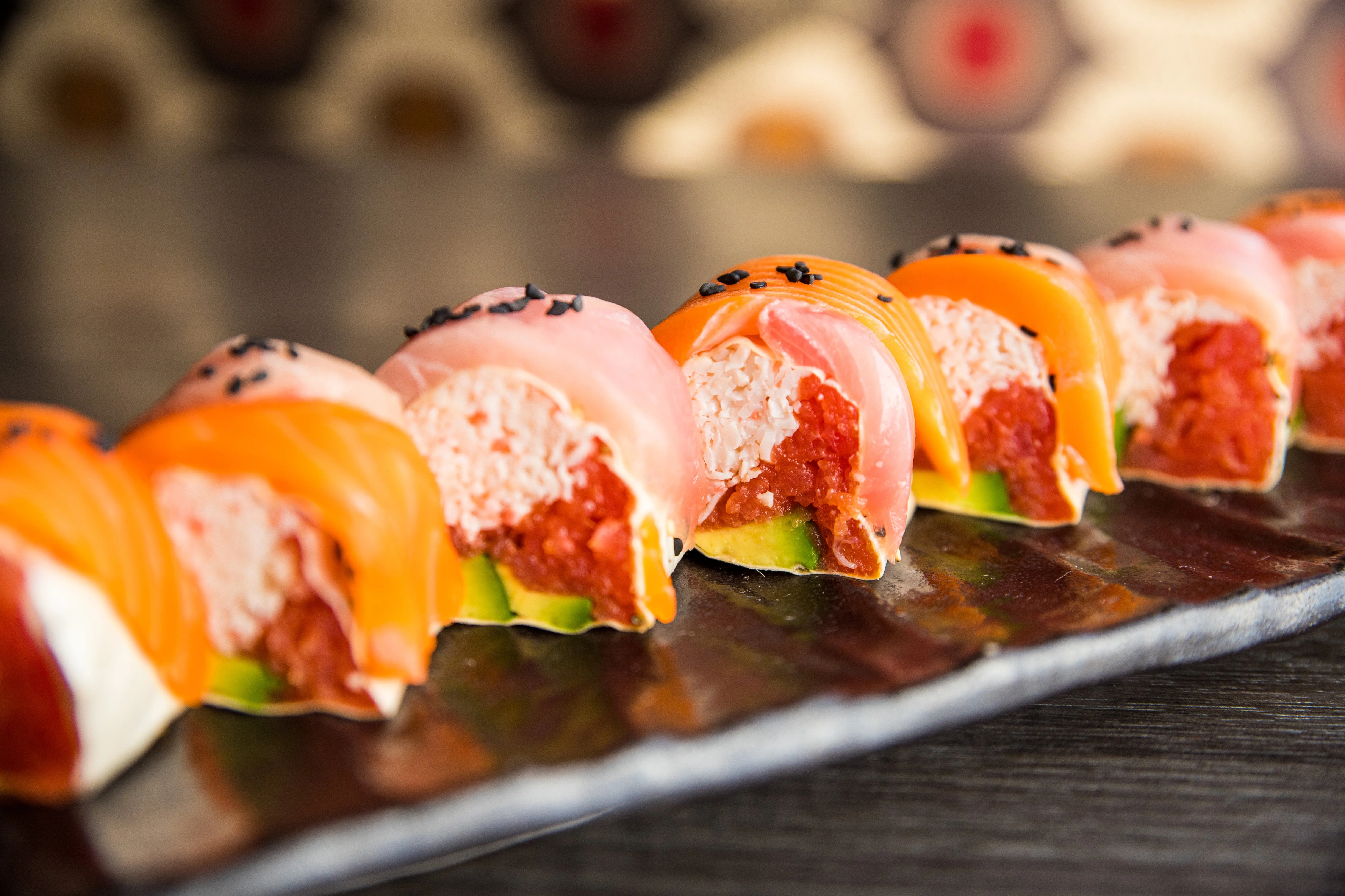 Colorful sushi rolls with salmon and crab