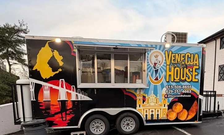 Venezuelan food truck named 'Valencia House' in a parking lot