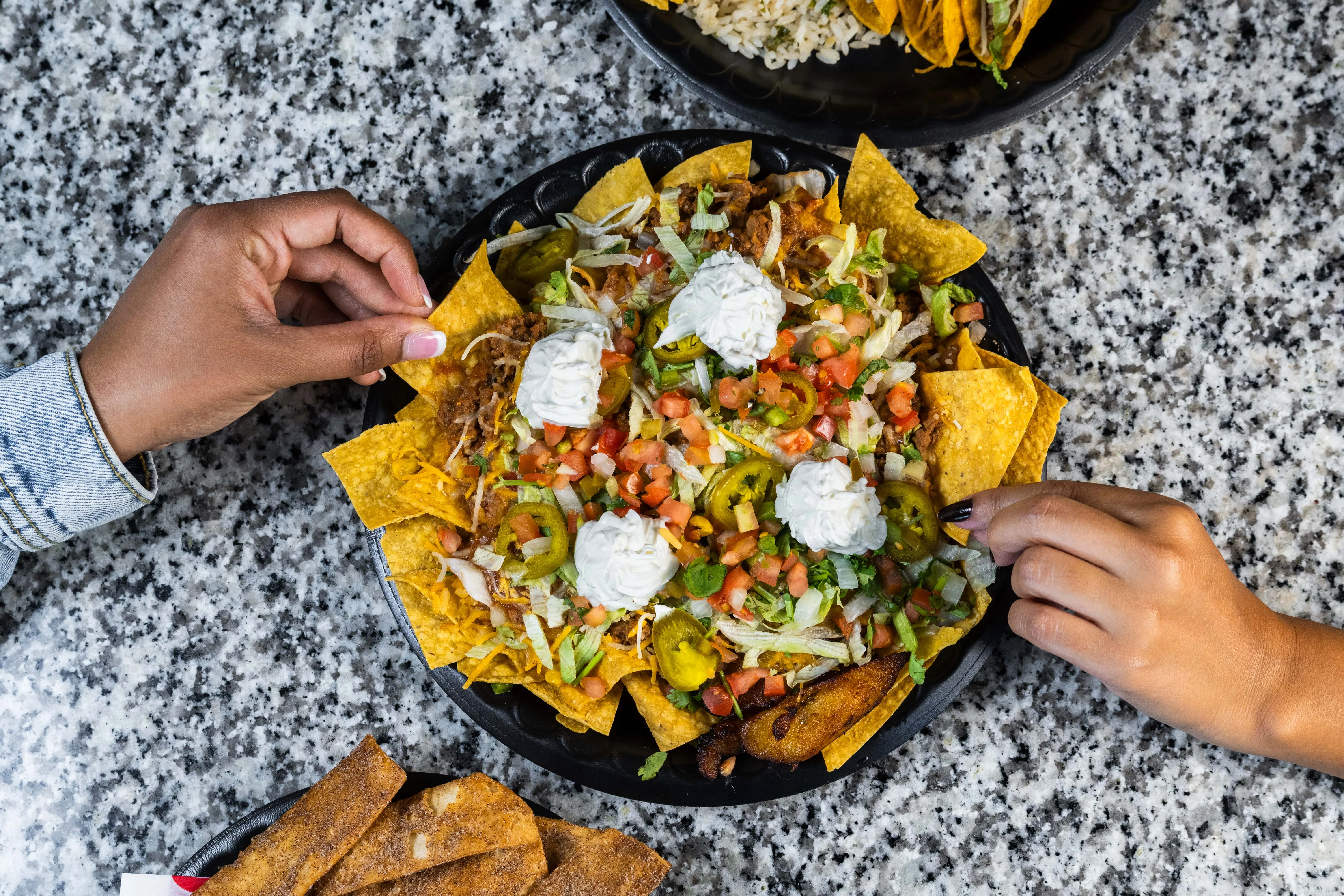 Loaded nachos with toppings in a vibrant setting