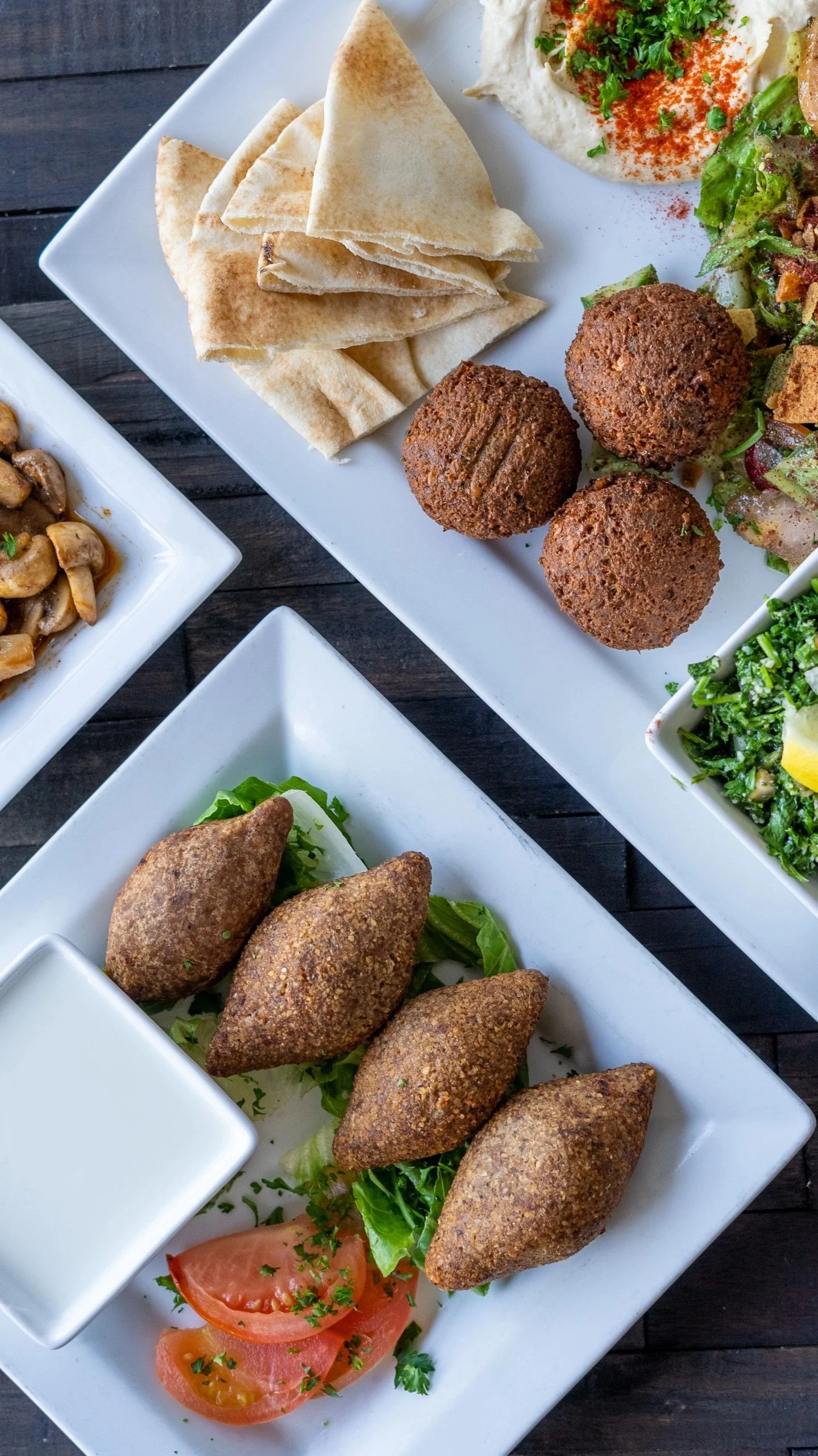 A beautifully arranged table with delicious dishes and drinks.