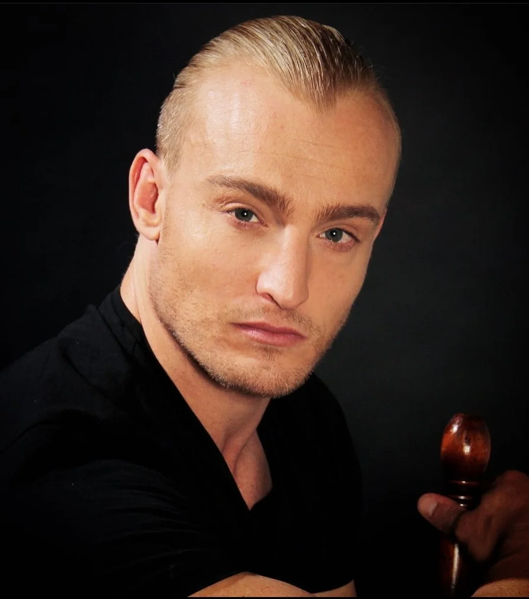 Portrait of a confident man with slicked-back hair