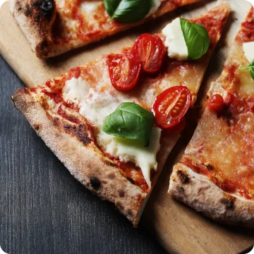 Margherita pizza with fresh basil and cherry tomatoes