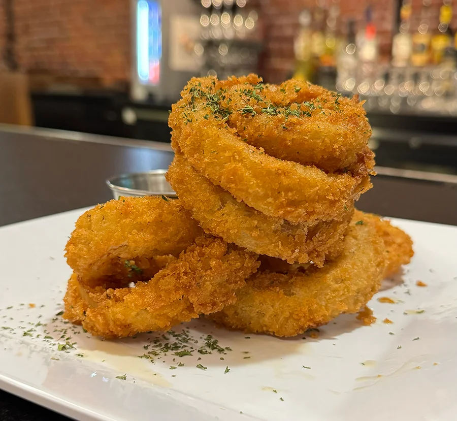 Crispy onion rings served with dipping sauce