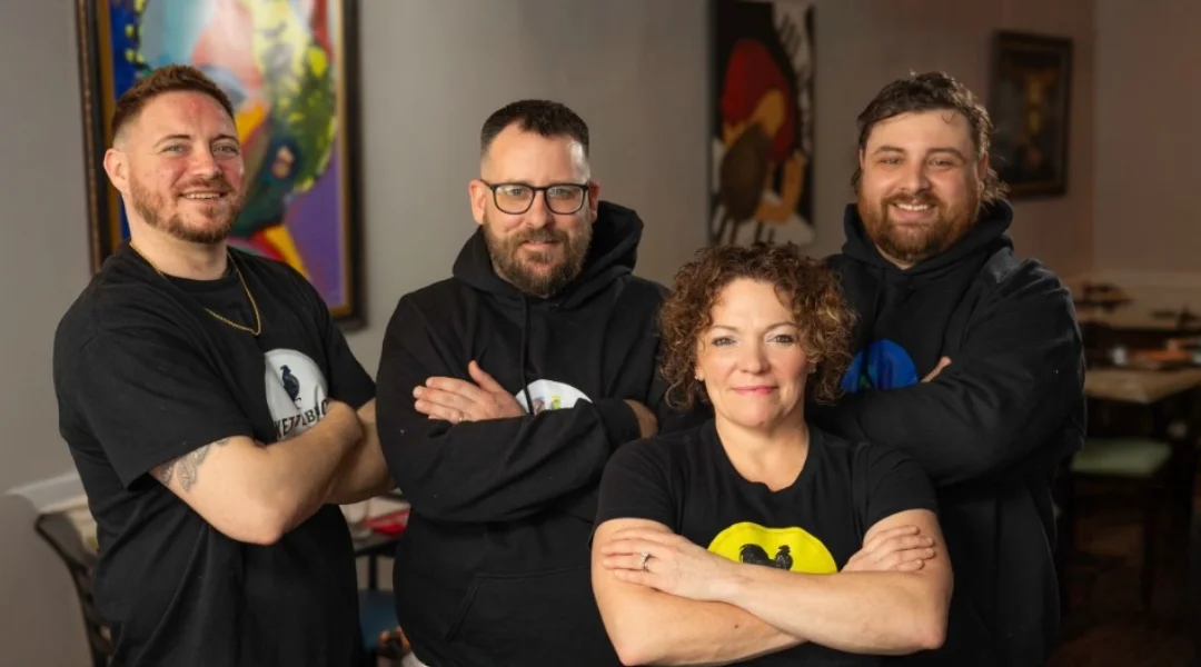 Restaurant team posing confidently in casual attire