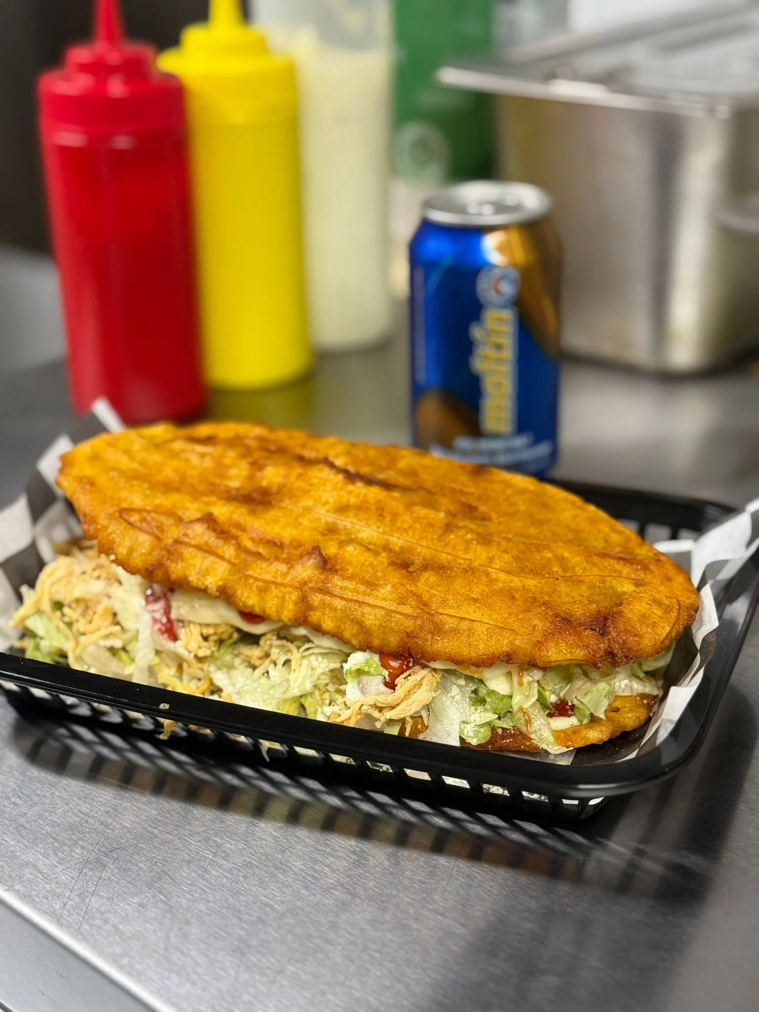 Delicious Venezuelan arepa filled with shredded chicken and fresh toppings