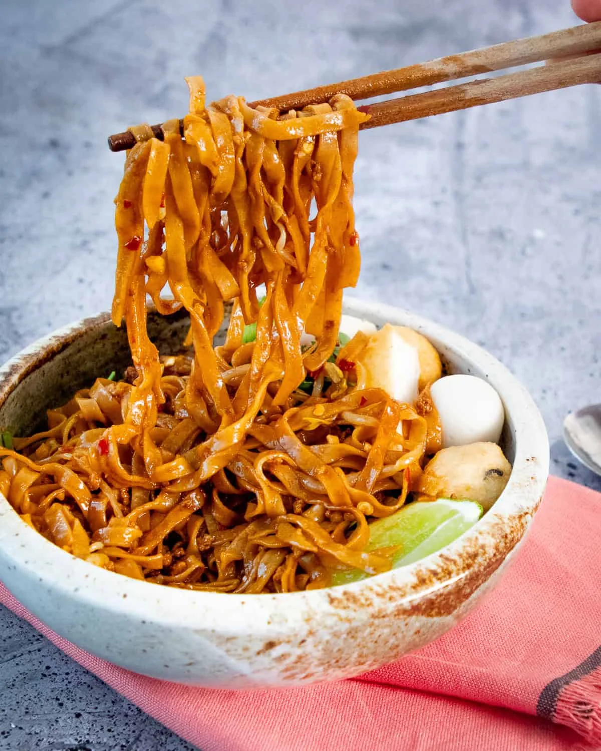 Spicy Malaysian char kway teow with noodles and fish balls