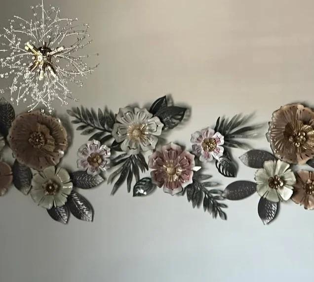 Elegant restaurant wall decor with floral metal art and modern lighting