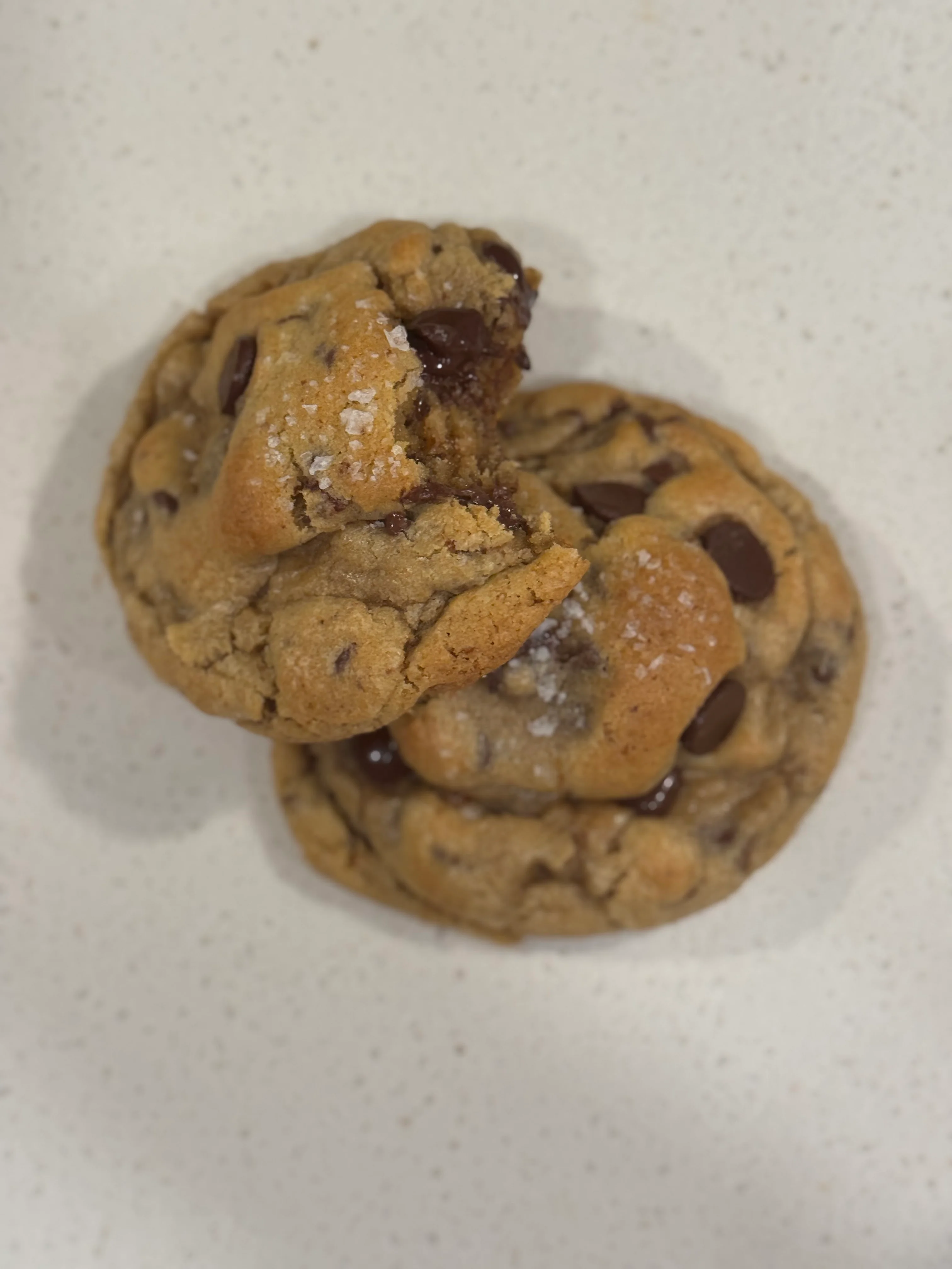Freshly baked chocolate chip cookies with sea salt